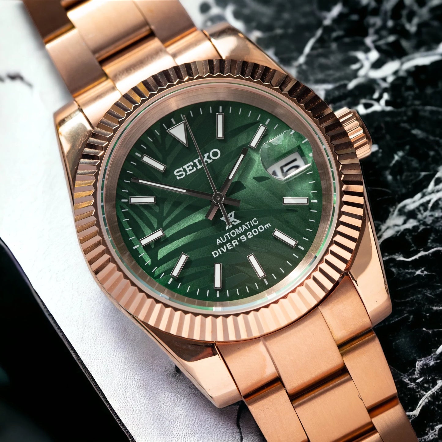 Datejust mod with green dial and rose gold bracelet