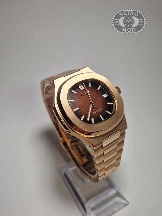 Nautilus mod with black dial rose gold bracelet